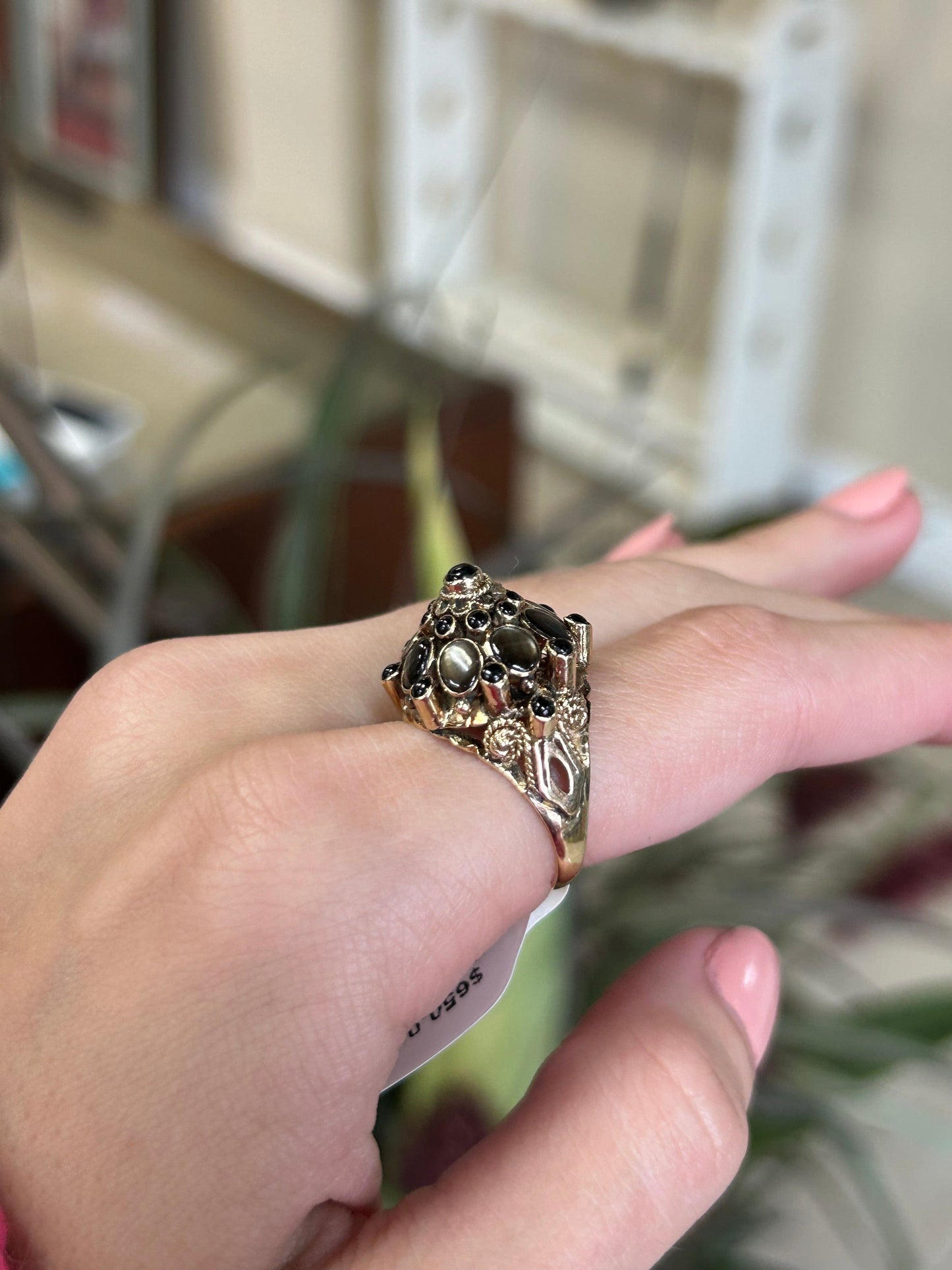 a woman's hand with a ring on it