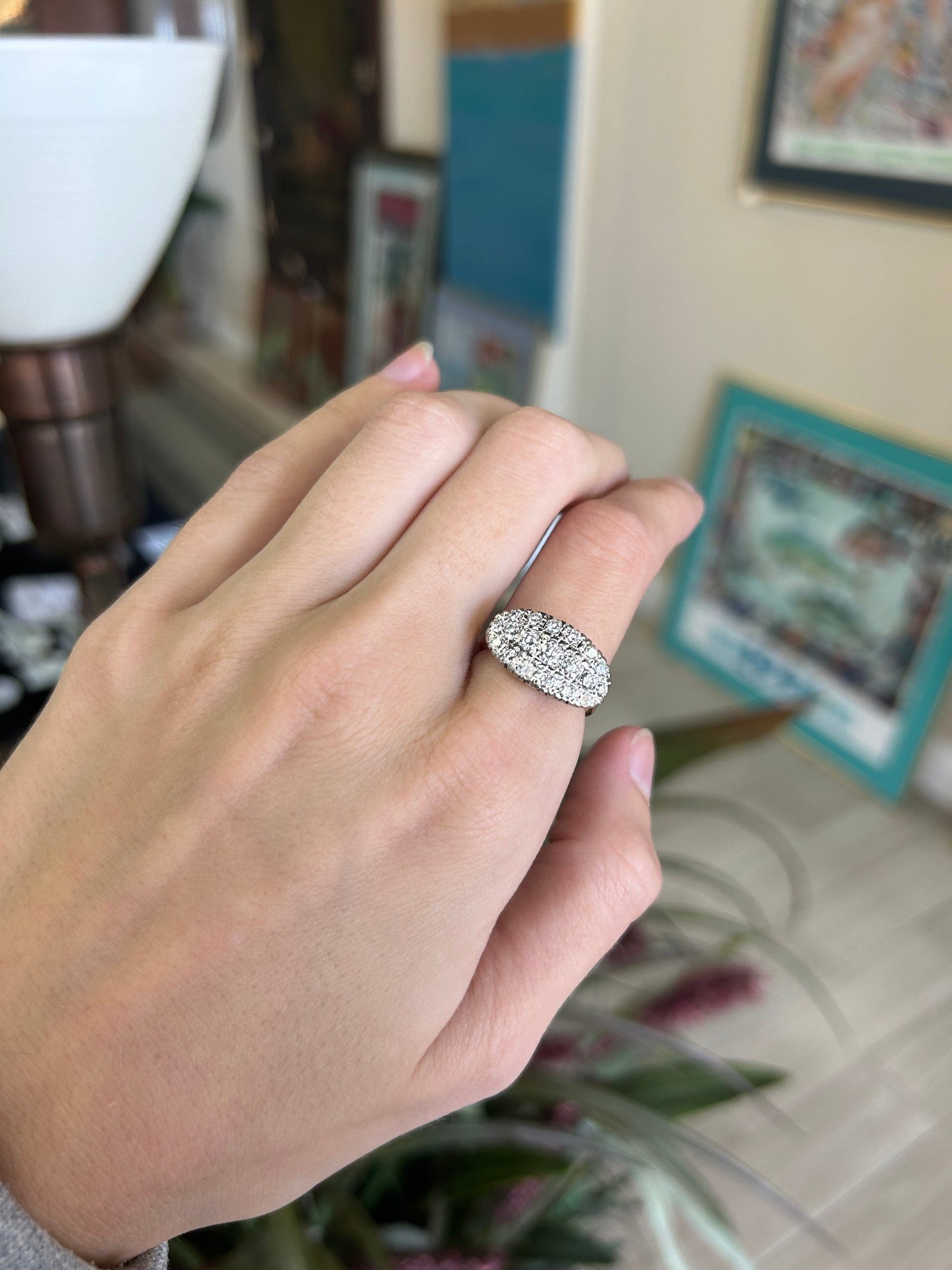 a woman's hand with a ring on it