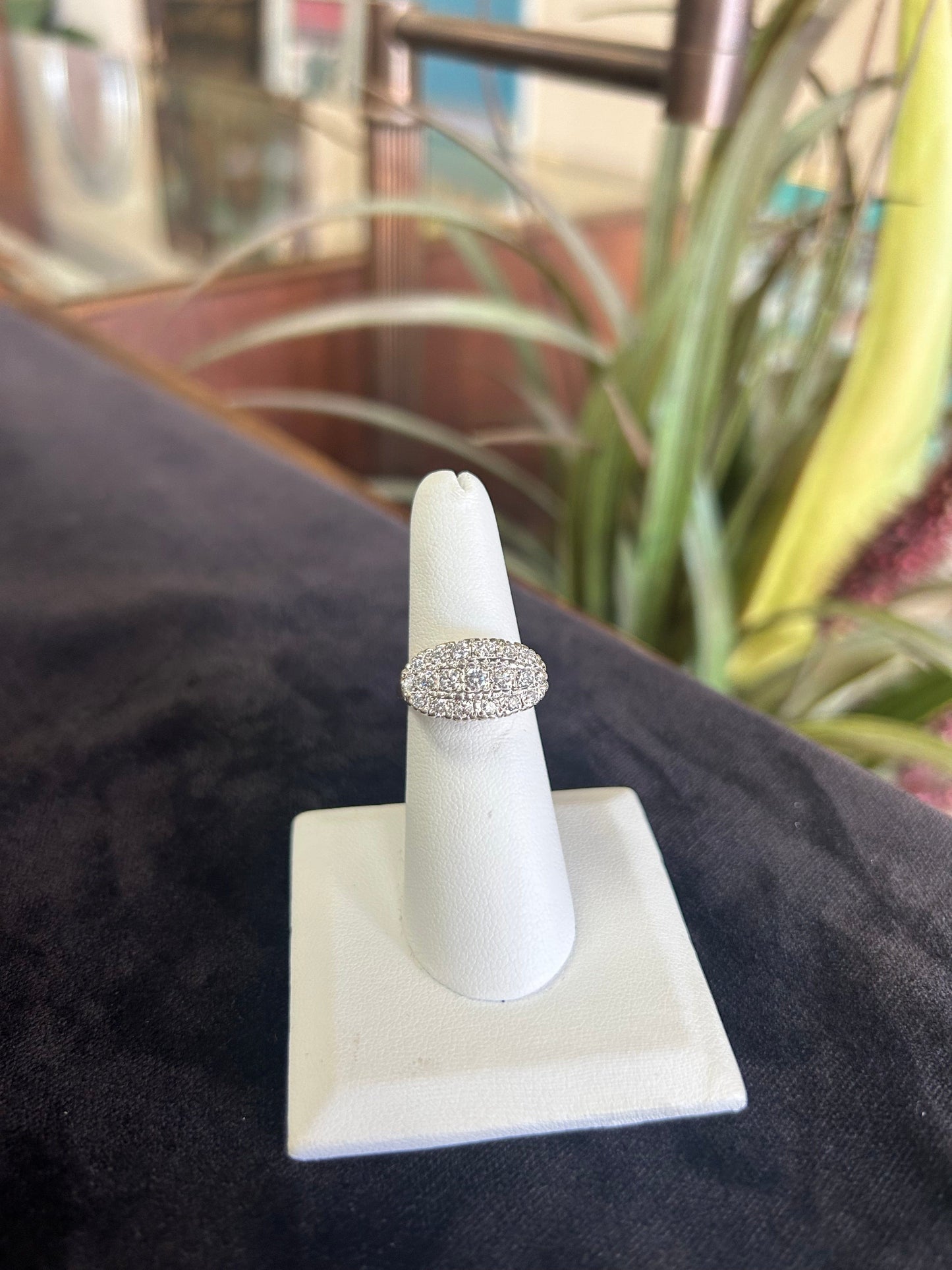 a diamond ring on a white ring holder