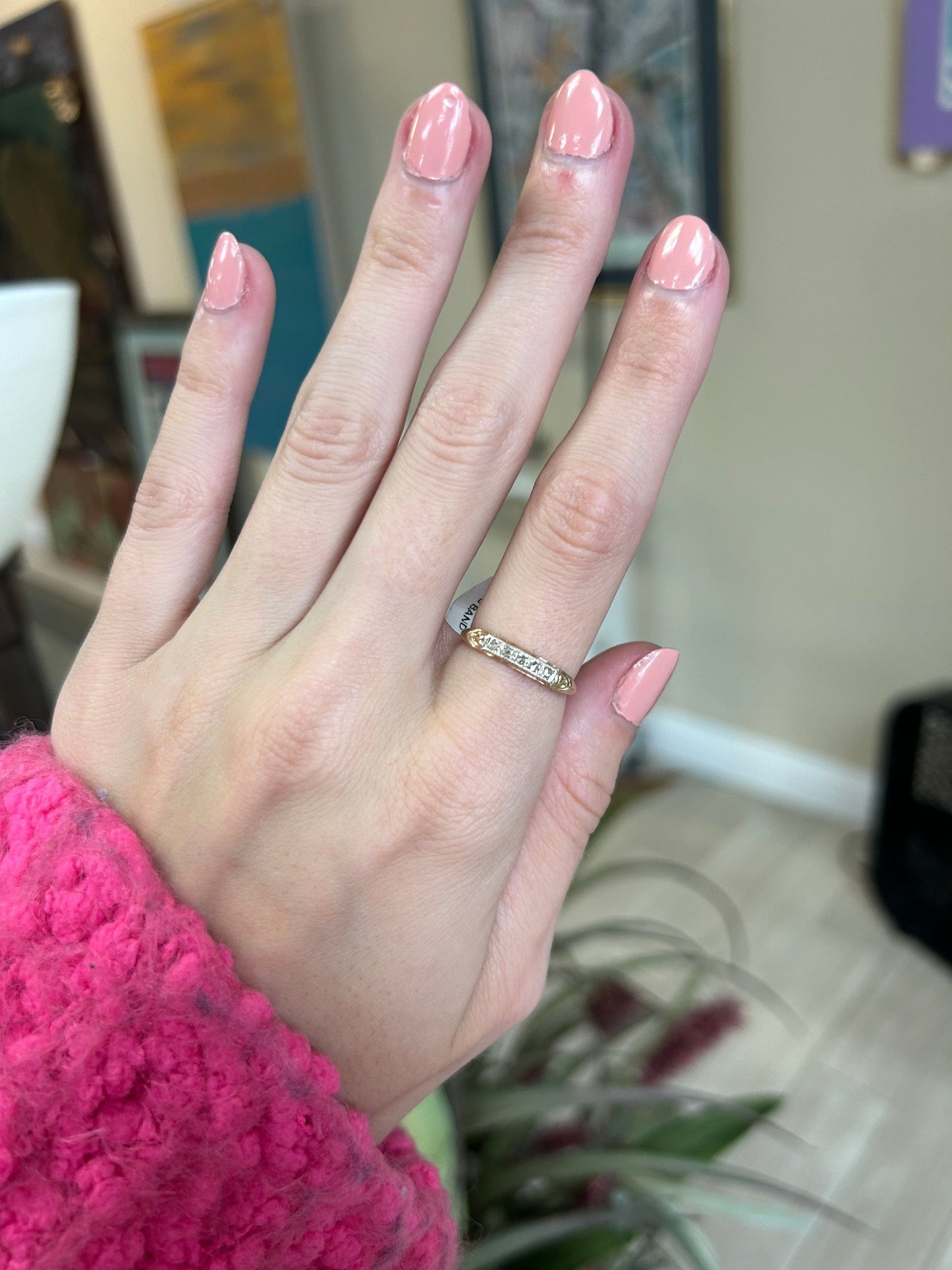 a woman's hand with a ring on it