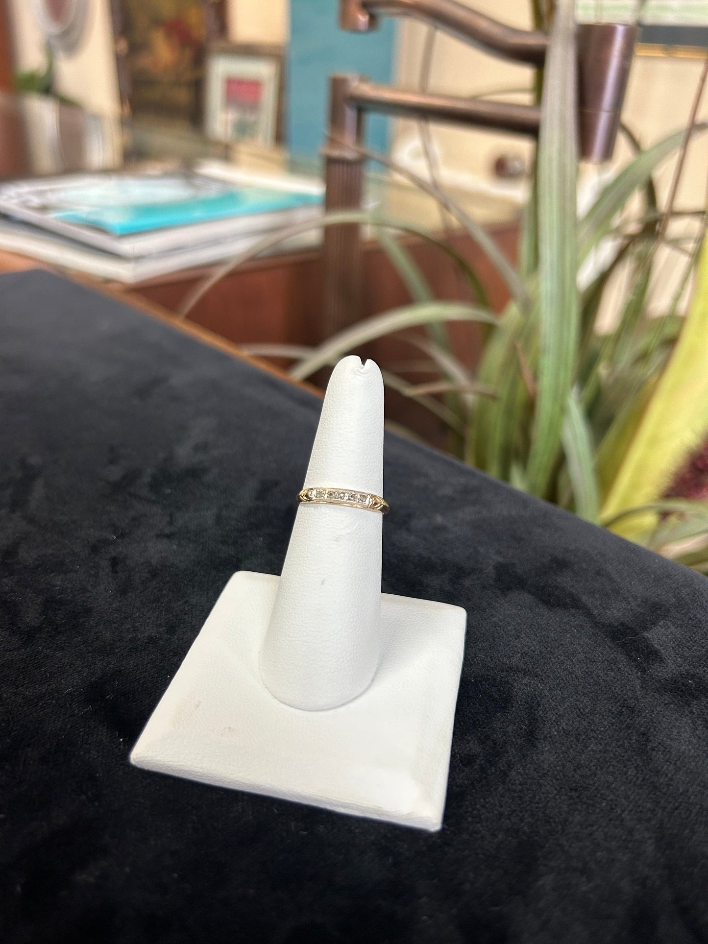 a close up of a ring on a white ring holder