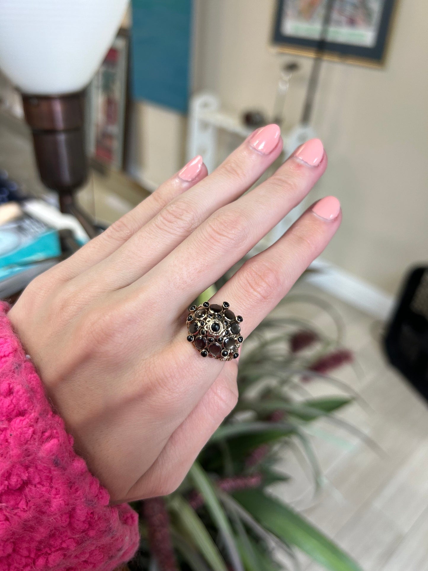 a woman's hand with a ring on it