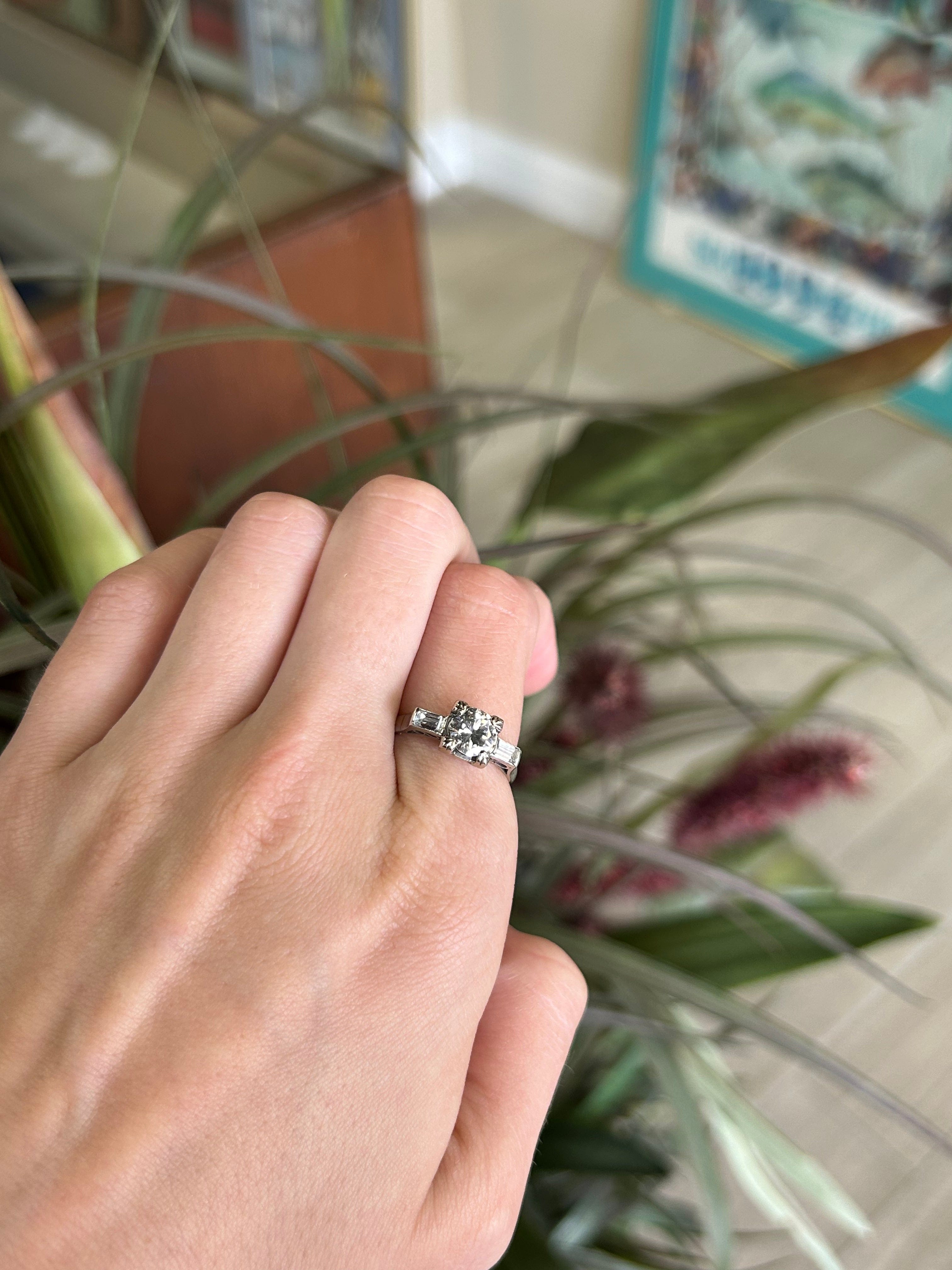 Round Brilliant Cut Center stone with Baguette Side Stones Engagement Ring