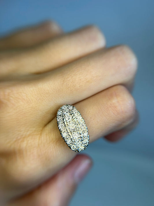 a close up of a person's hand holding a ring
