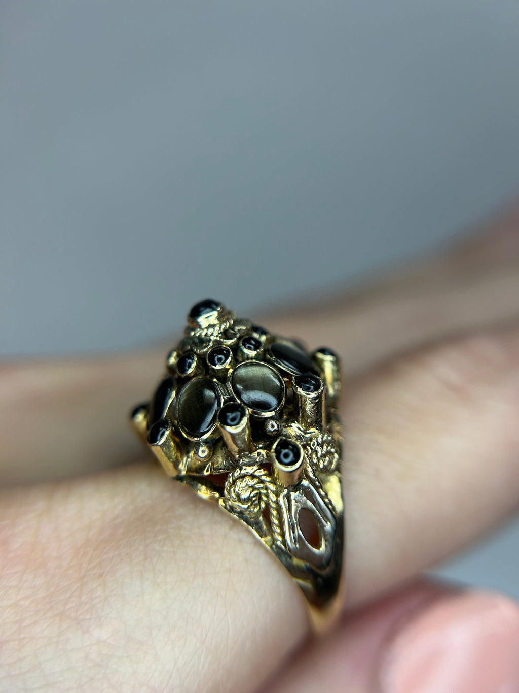 a close up of a person wearing a ring