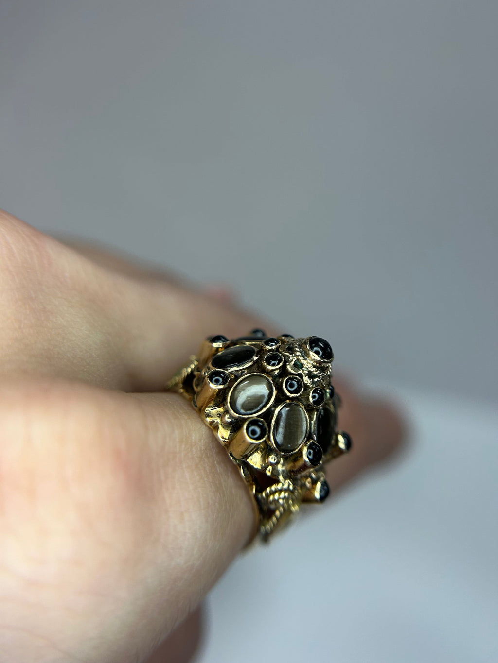 a close up of a person wearing a ring