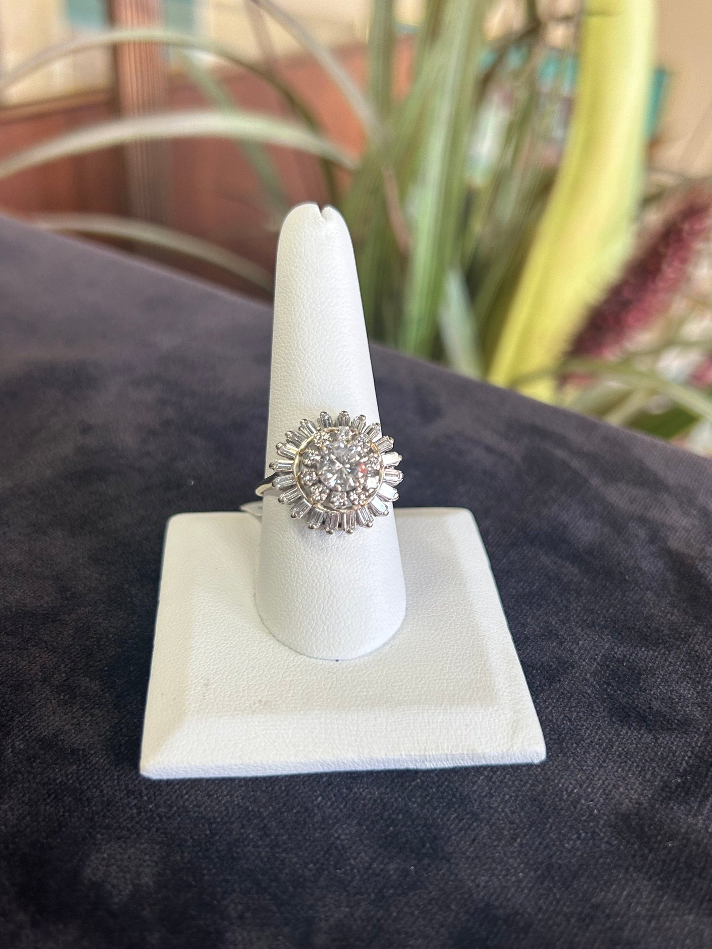a diamond ring on a white ring holder