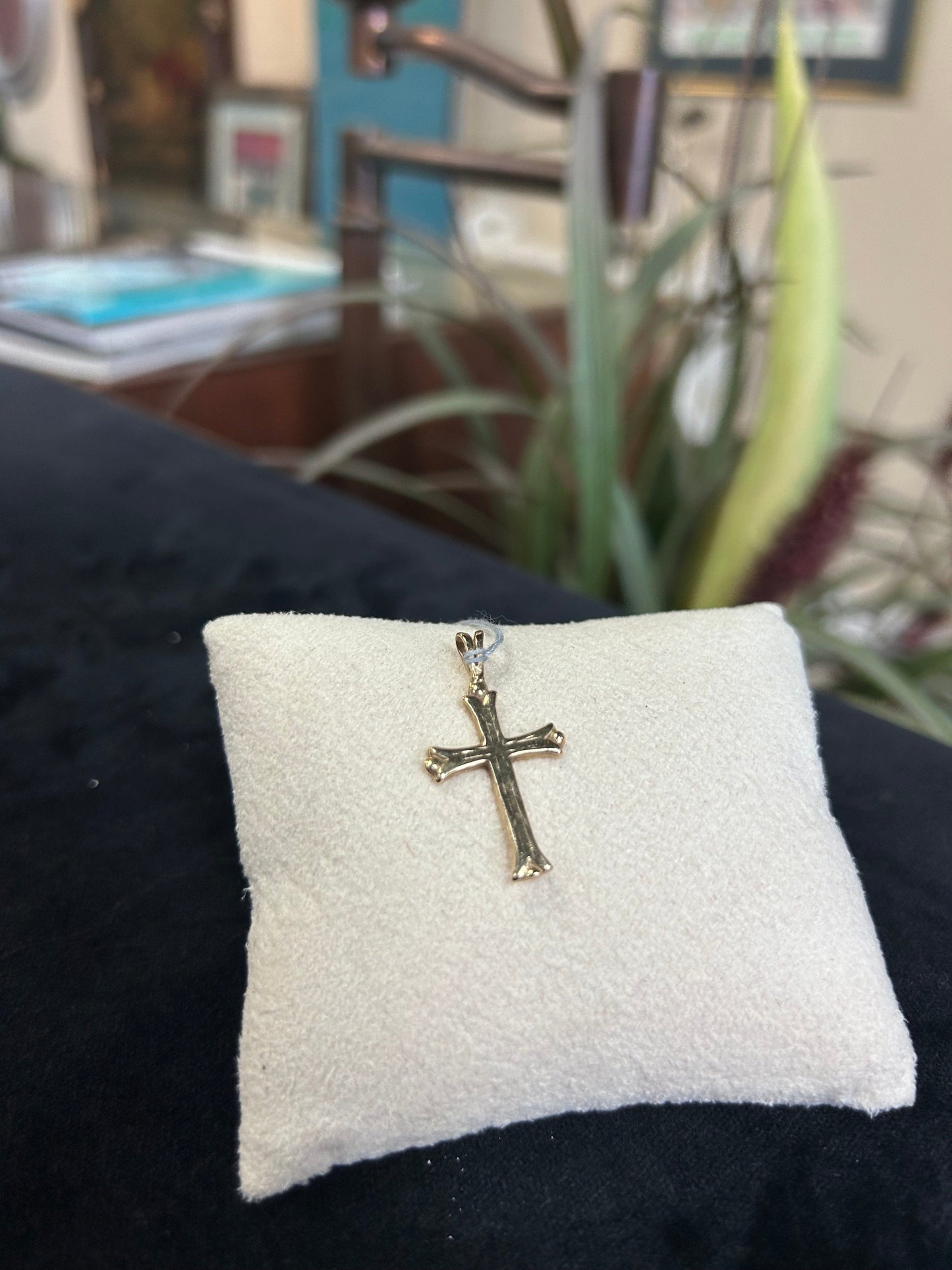 a close up of a cross on a pillow