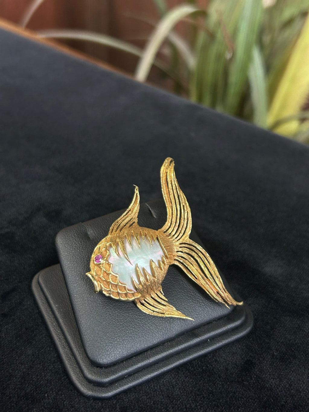 a close up of a ring with a bird on it