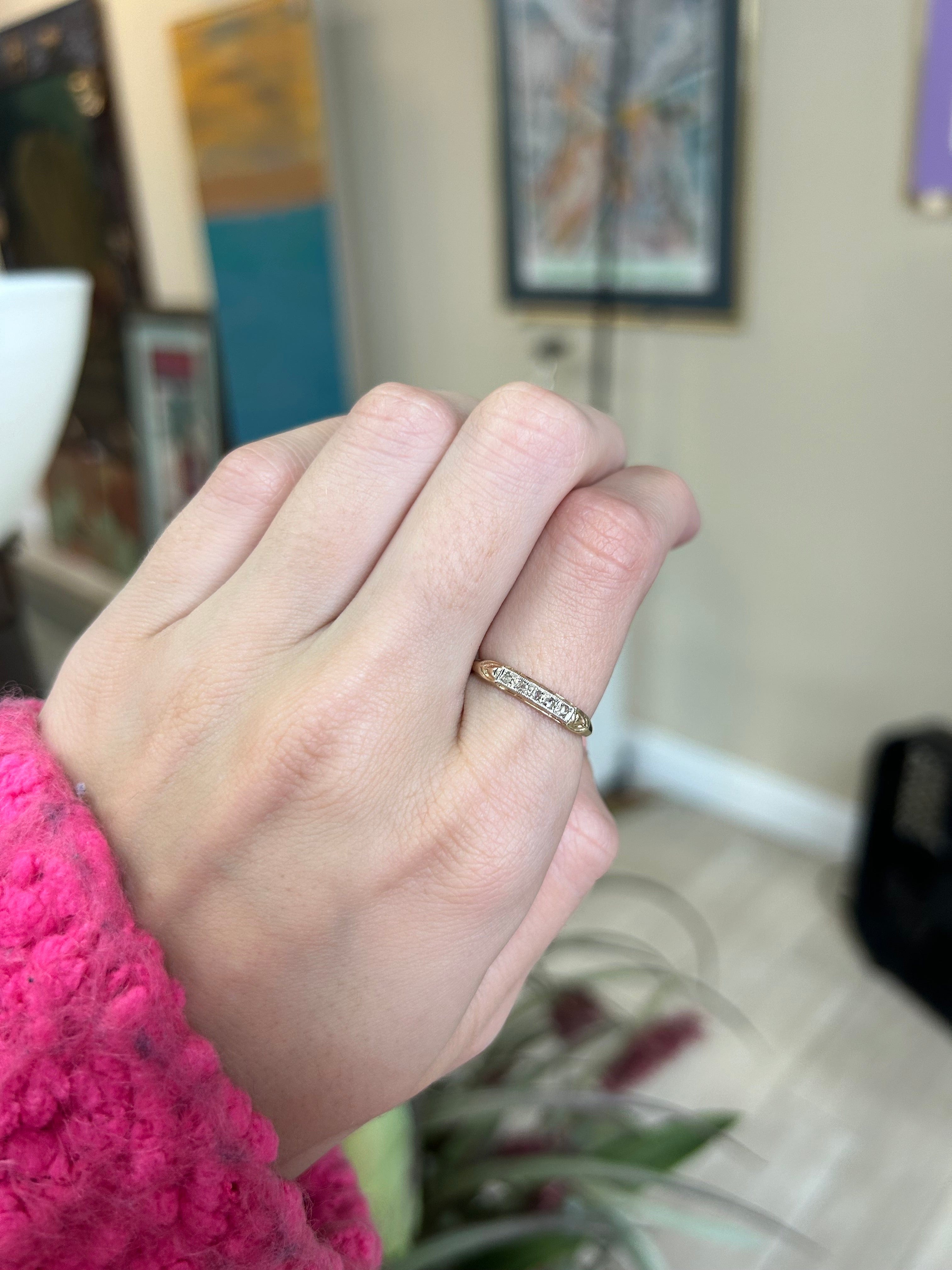 a person holding a ring in their hand